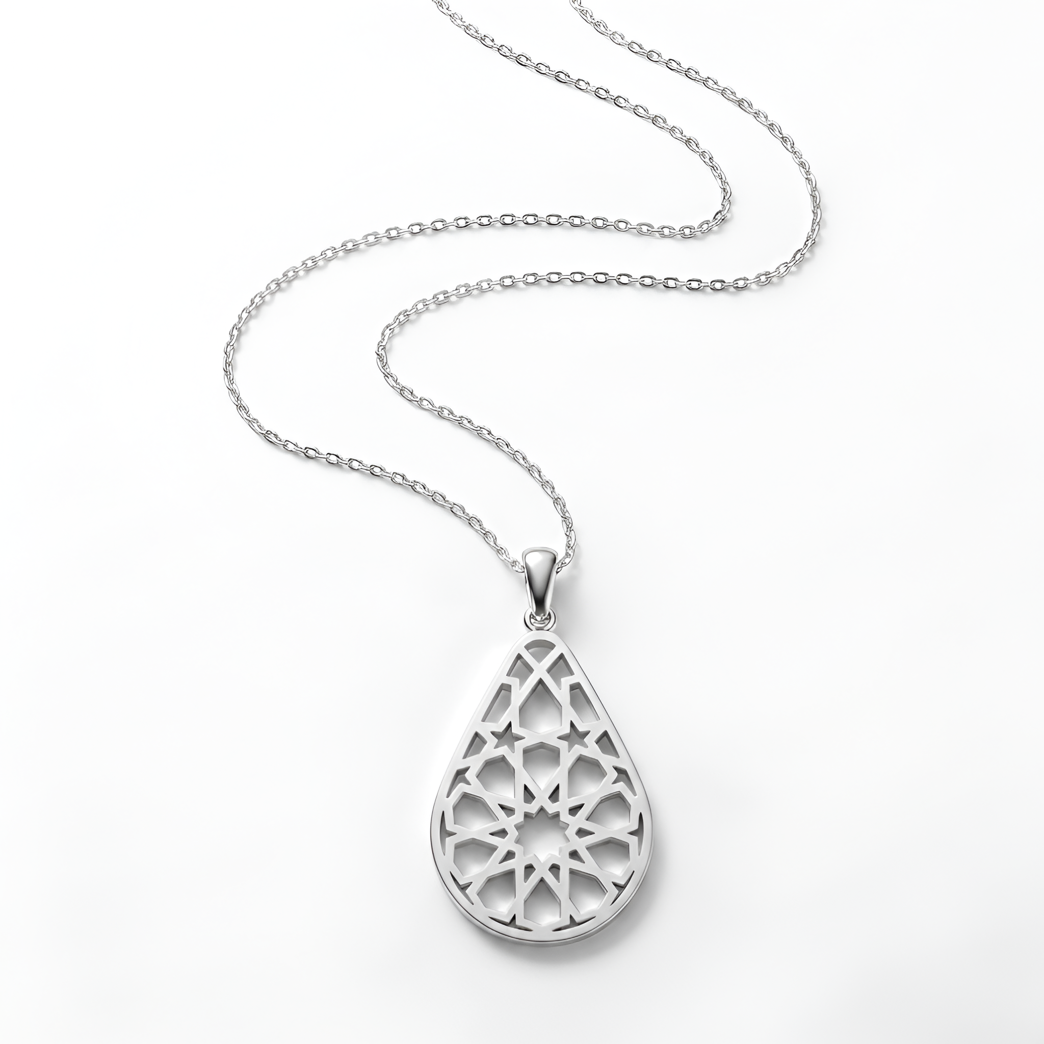 Elegant handcrafted 925 sterling silver arabesque drop pendant necklace featuring intricate geometric cutout detailing inspired by timeless Middle Eastern artistry, designed for sophisticated everyday elegance, luxury styling, and meaningful silver gift by Saad of Egypt.