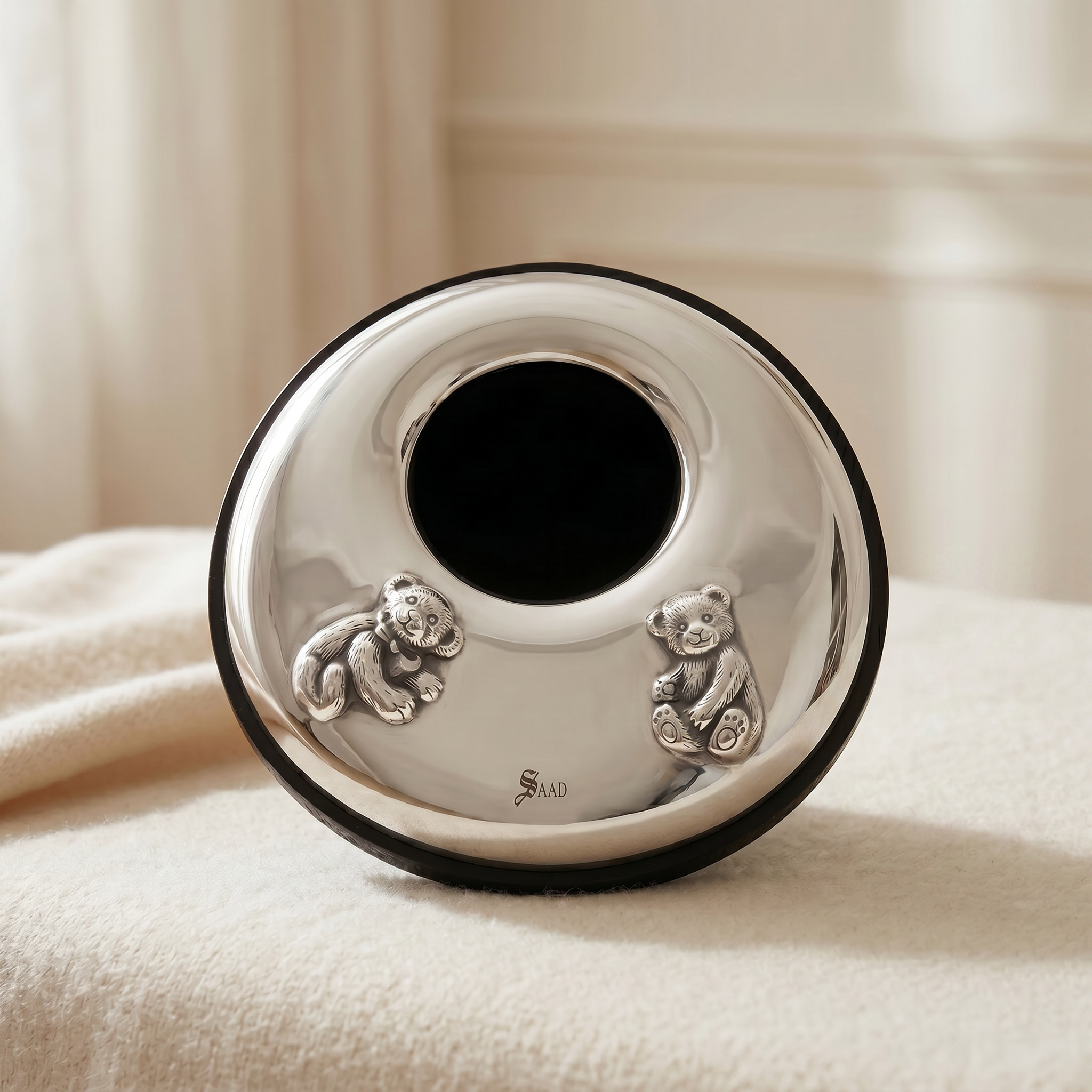 Elegant handcrafted 900 premium silver baby photo frame with playful teddy bear details, designed as a meaningful newborn gift by Saad of Egypt.