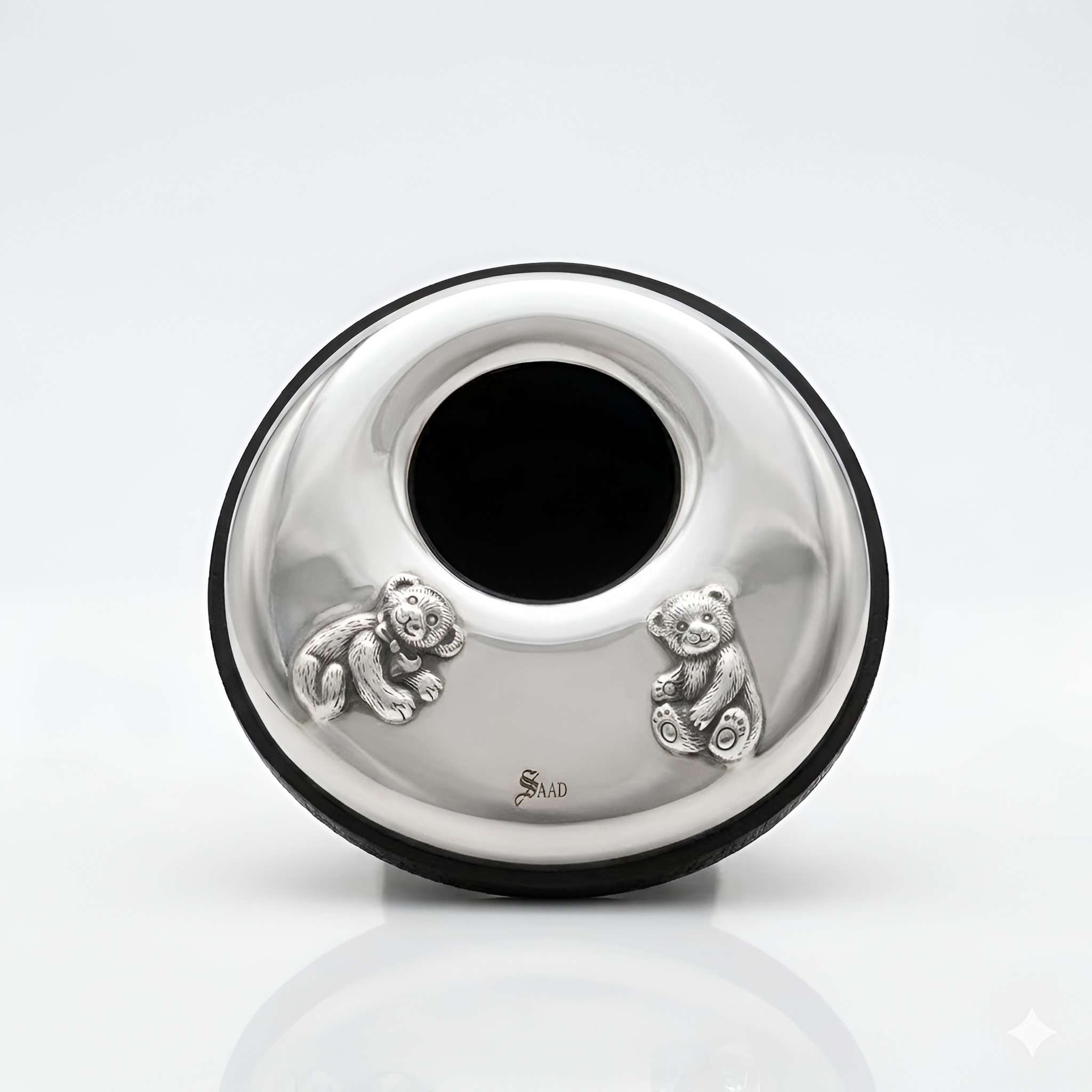 A charming handcrafted baby photo frame in 900 premium silver, designed with delicate playful details to preserve your most precious memories, a meaningful baby gift by Saad of Egypt.