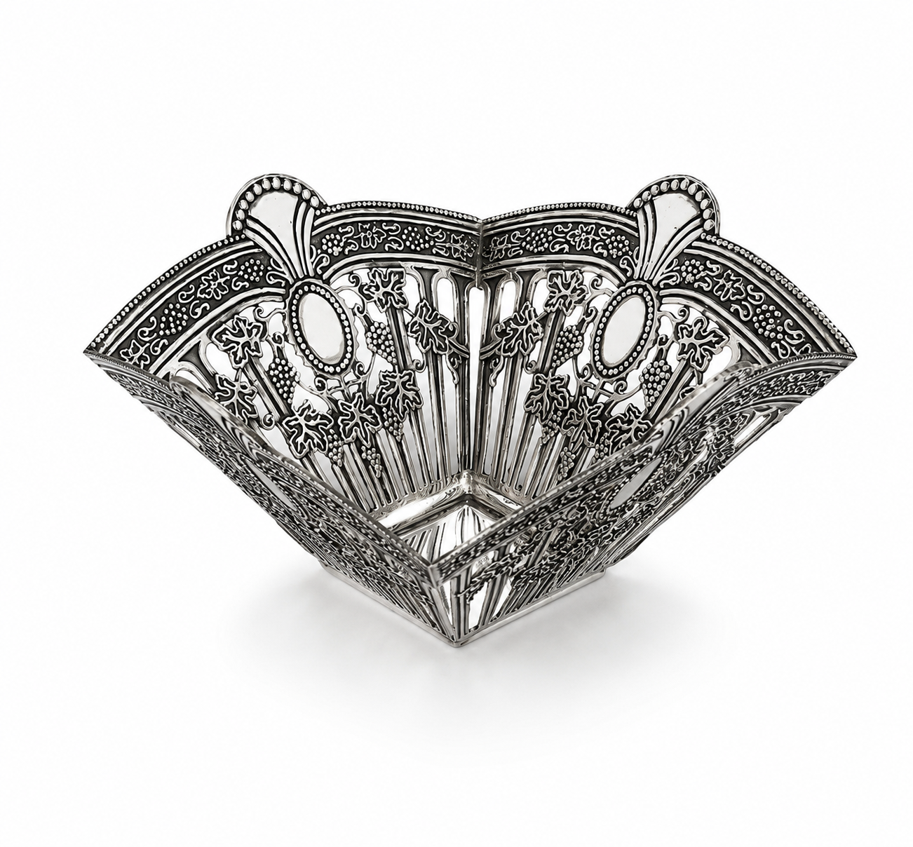 Handcrafted royal silver serving bowl captured from a side angle highlighting intricate engraved patterns and elegant craftsmanship, perfect for luxury gifting and refined home décor.