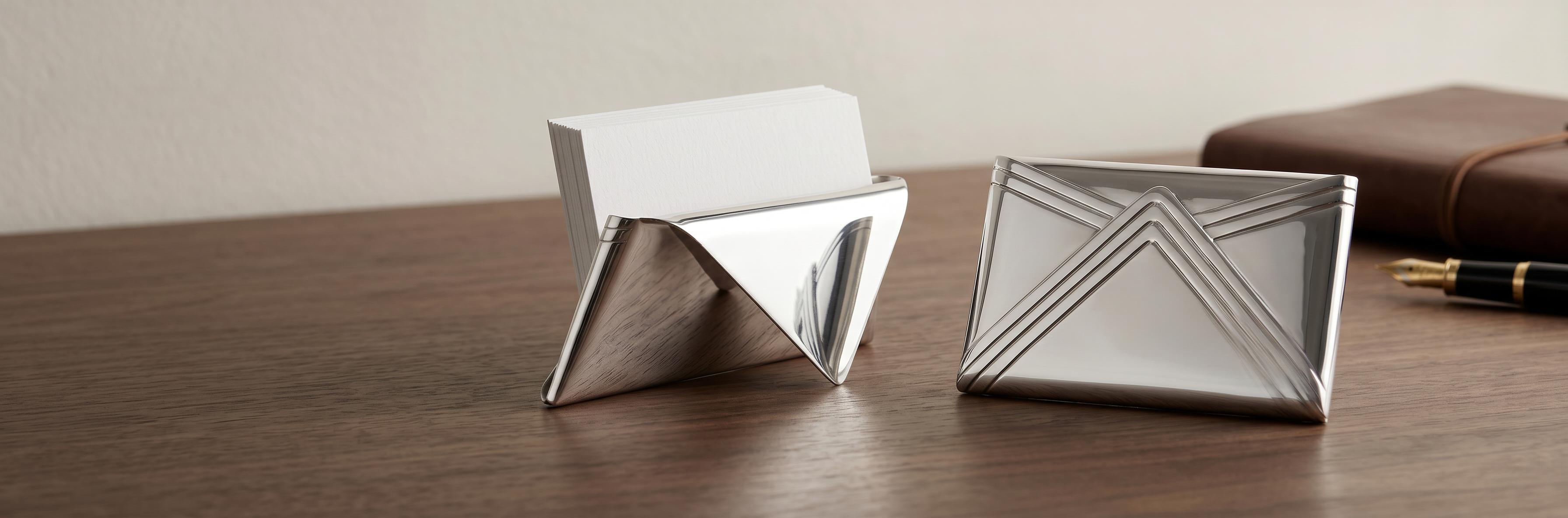 Modern desk card holders by Saad of Egypt crafted in 925 sterling silver featuring sleek geometric luxury office accessory designs.