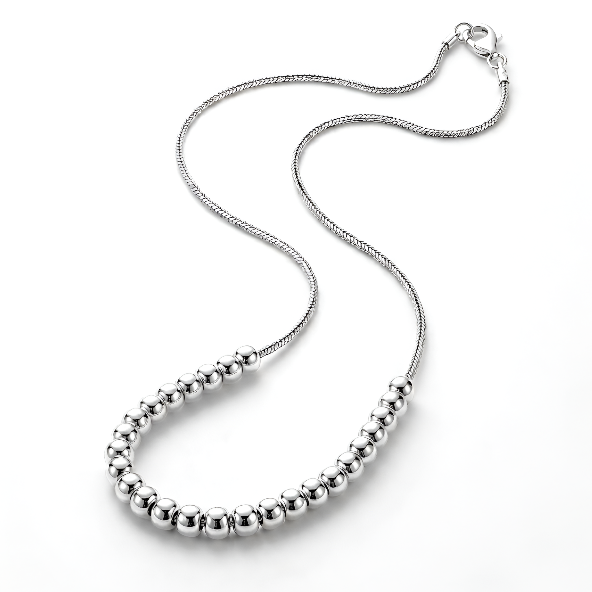 Angled view of an elegant 925 sterling silver sphere necklace featuring graduated polished silver beads and a delicate chain, handcrafted for timeless sophistication, refined daily styling, and premium silver gift collections by Saad of Egypt.