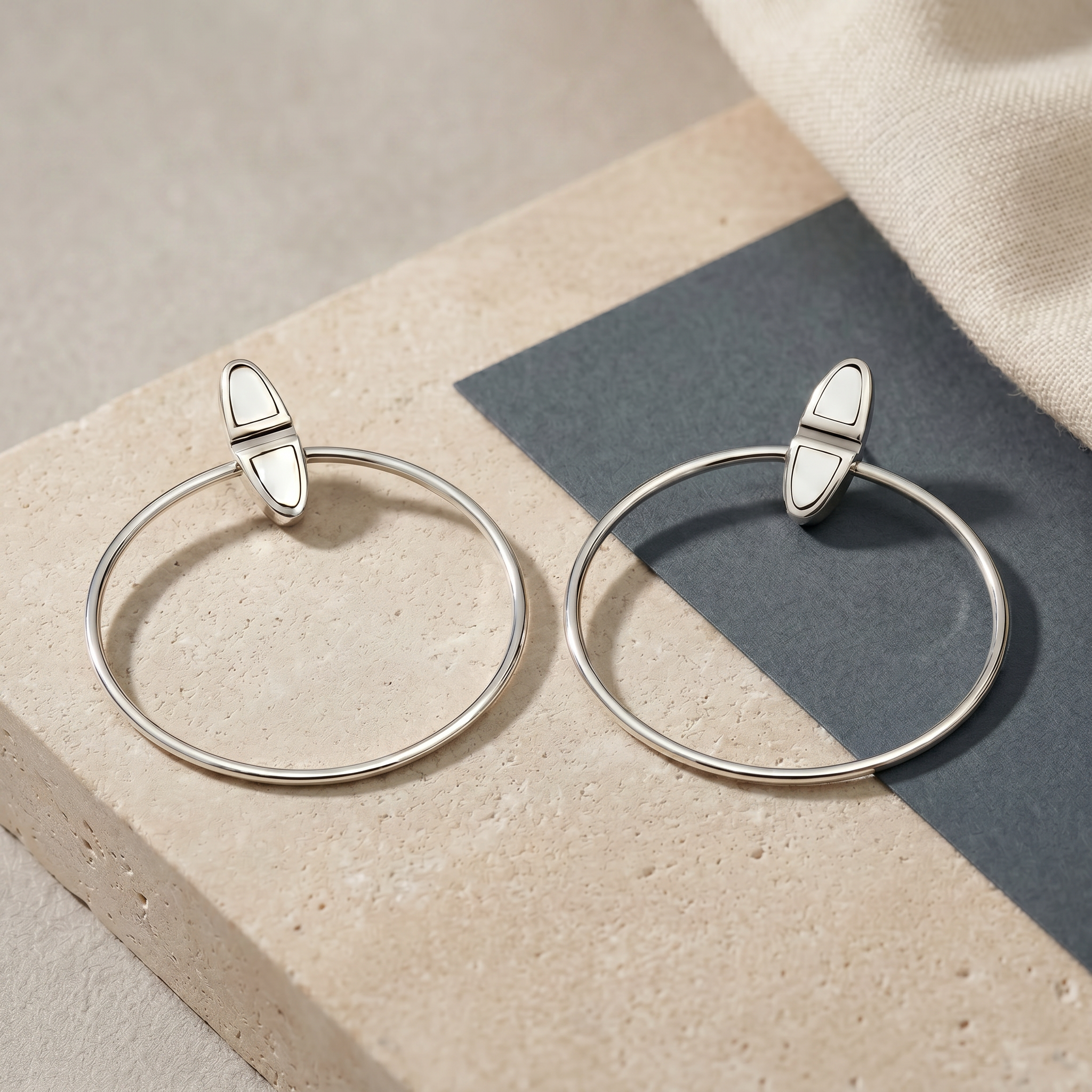 Elegant 925 sterling silver hoop earrings with a modern geometric design, handcrafted for women with a minimal and contemporary style by Saad of Egypt.