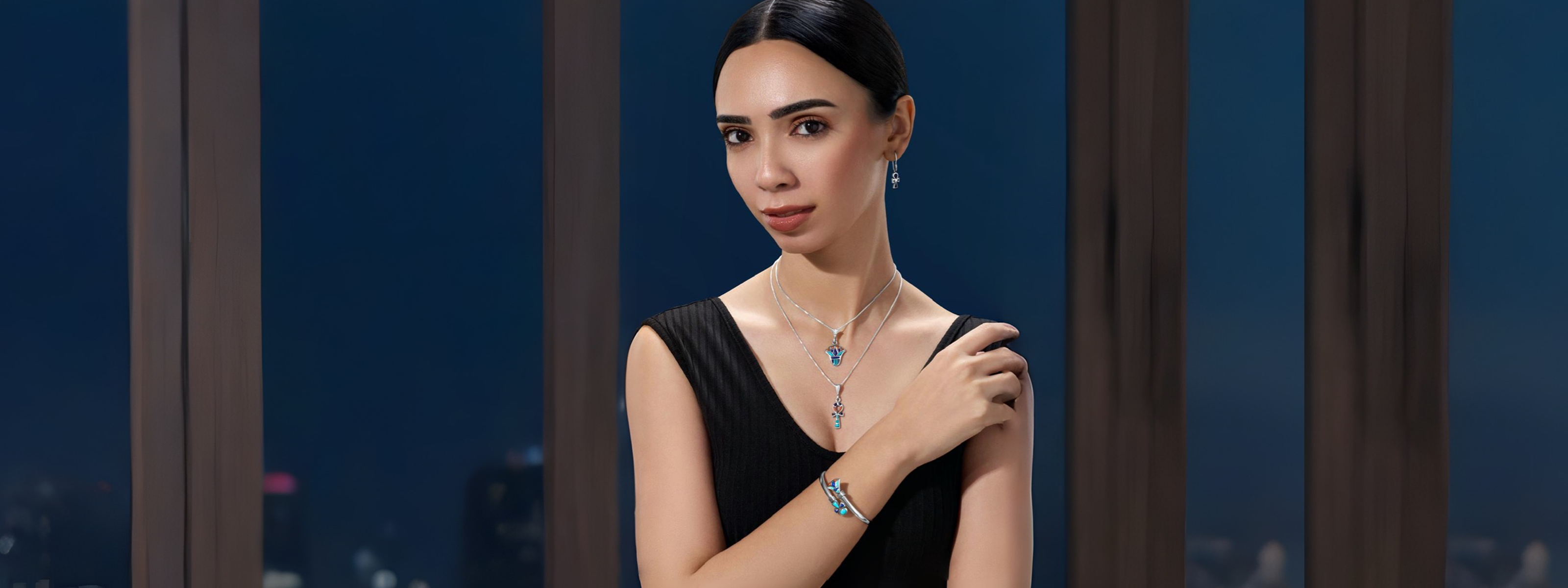An elegant woman wearing a coordinated 925 sterling silver jewelry set, styled in a luxurious evening setting, highlighting refined craftsmanship and a perfect gift for women by Saad of Egypt.