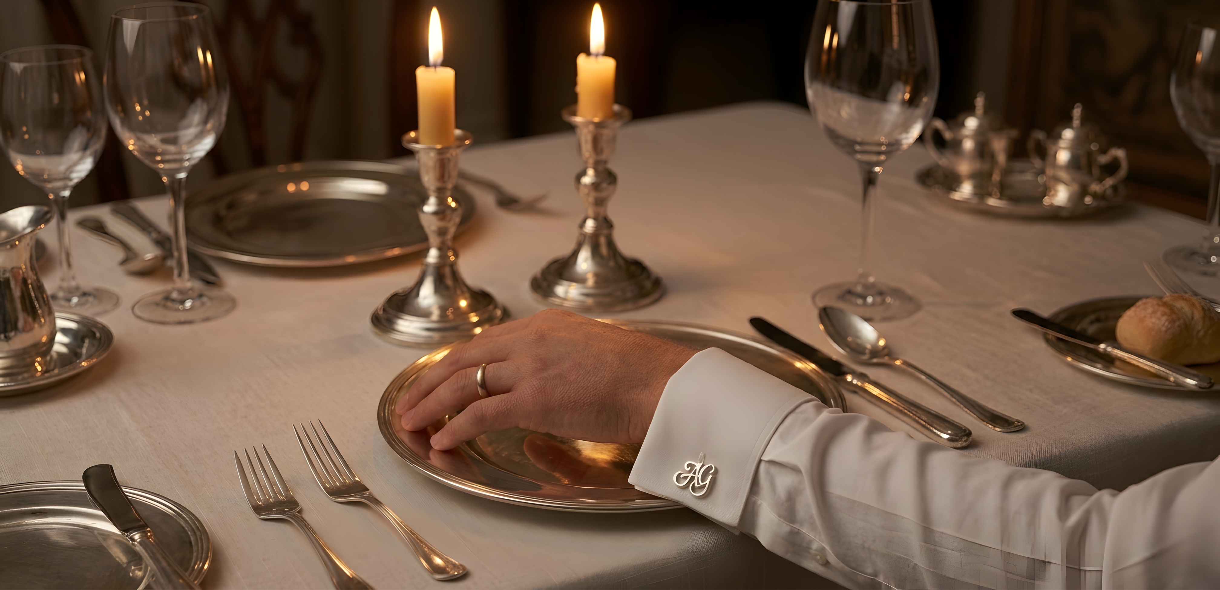 Elegant dining setup featuring customized sterling silver cufflinks, highlighting personalized design and sophisticated details by Saad of Egypt.