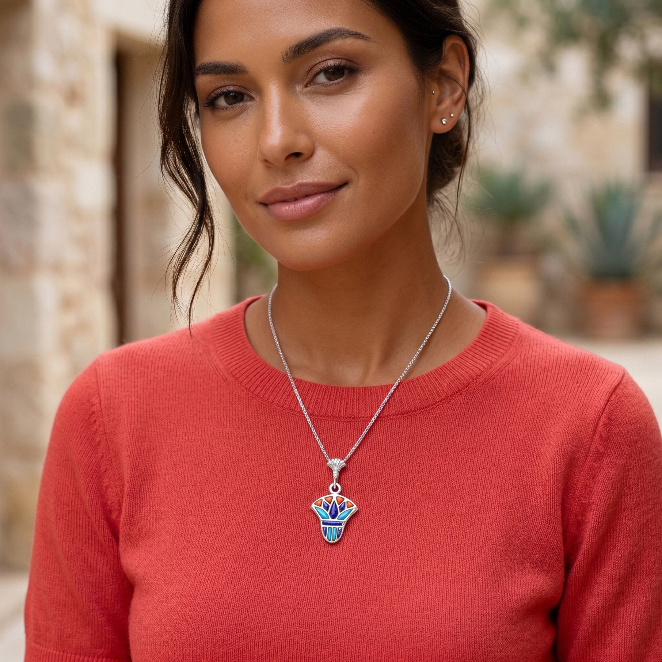 Elegant lifestyle portrait of a woman wearing a handcrafted 925 sterling silver lotus multi-colored pendant, a vibrant women’s gift inspired by harmony and crafted by Saad of Egypt.