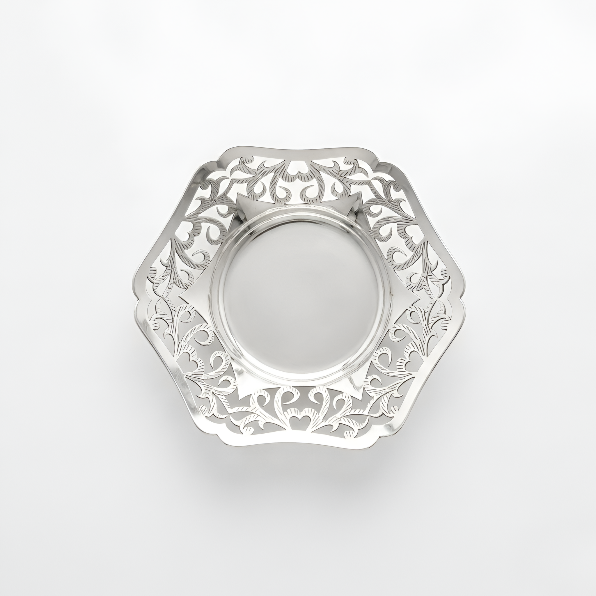 Close-up of a handcrafted small Ajur bowl in 900 premium silver featuring intricate cutout detailing, designed as an elegant home décor and gift piece by Saad of Egypt.
